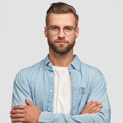 handsome-bearded-guy-posing-against-white-wall_273609-20597